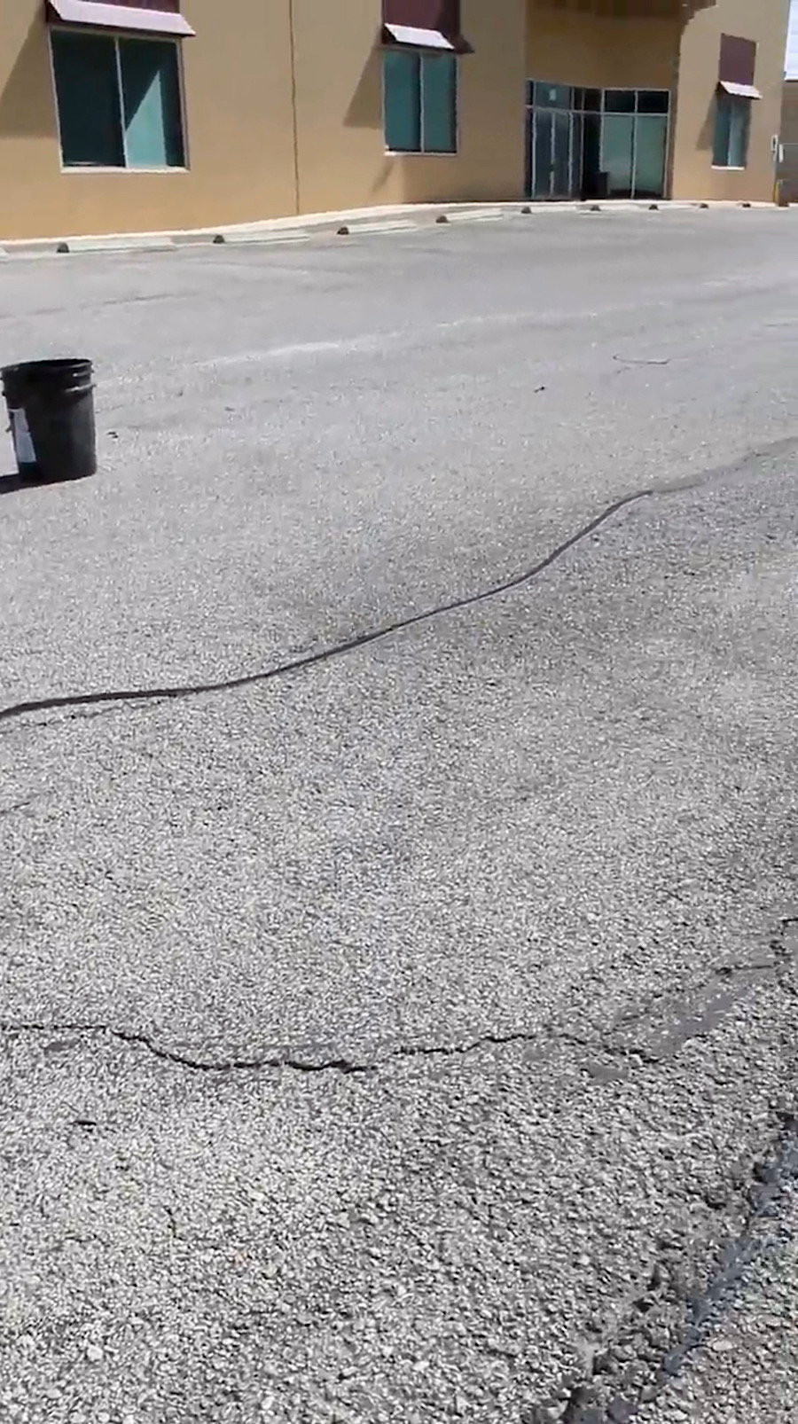 Shopping center line striping asphalt cracking